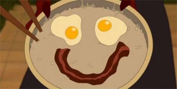 Illustration tirée d'un film Disney montrant un bol de ramen avec un visage souriant composé de deux œufs en guise d'yeux et d'une bande d'algues en guise de bouche.