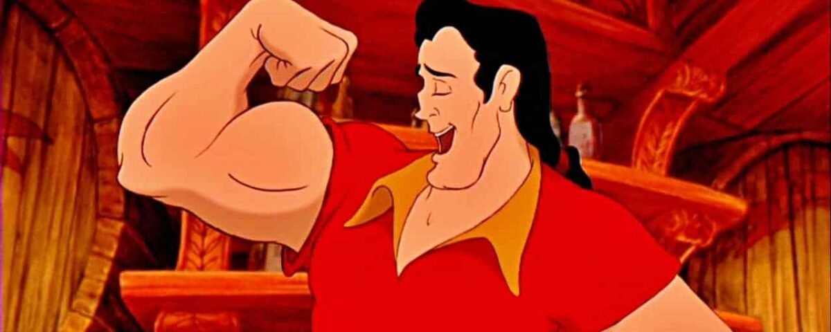 Personnage animé Gaston de « La Belle et la Bête », l'un des méchants de Disney, fléchissant ses biceps avec un sourire narquois dans une taverne, montrant sa musculature. Il porte un