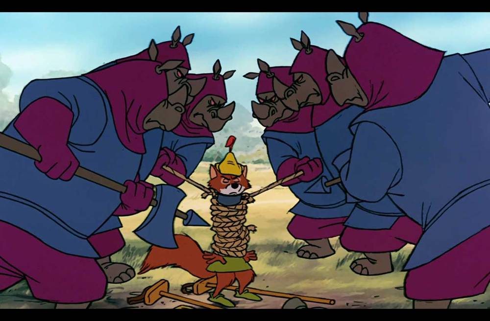Illustration tirée d'un film d'animation montrant un petit héros populaire provocateur vêtu d'orange, ligoté et entouré de quatre grands personnages menaçants vêtus de tenues violettes et coiffés de casques ressemblant à des rhinocéros.