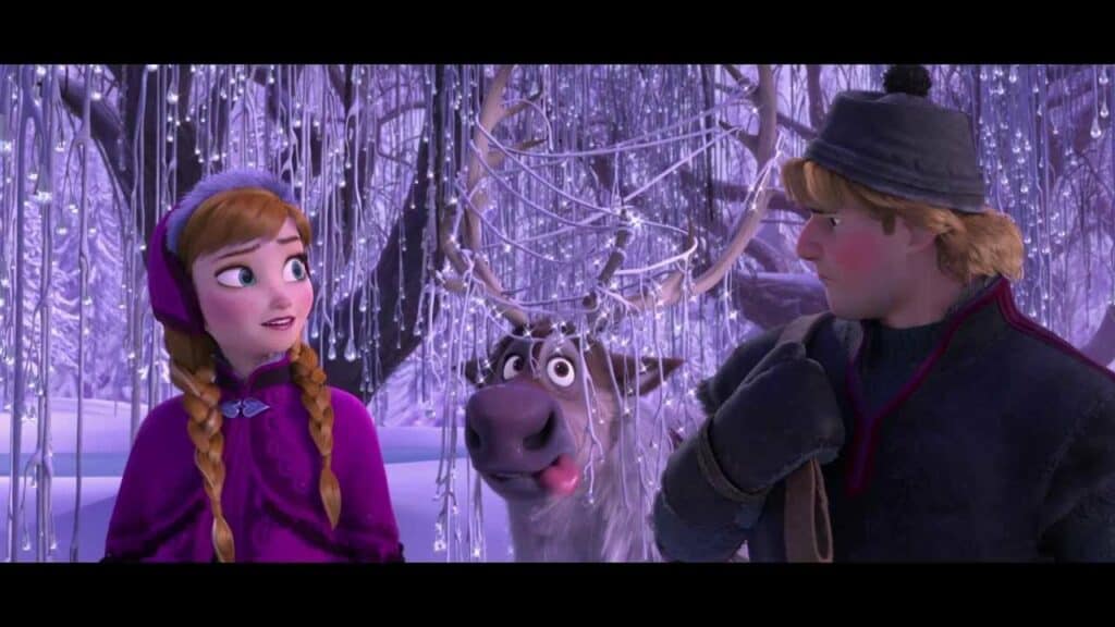 Dans un paysage enneigé et glacé, les personnages animés Anna et Kristoff ainsi que le renne Sven partagent un moment. Anna a l'air pleine d'espoir, Kristoff semble pensif et Sven est