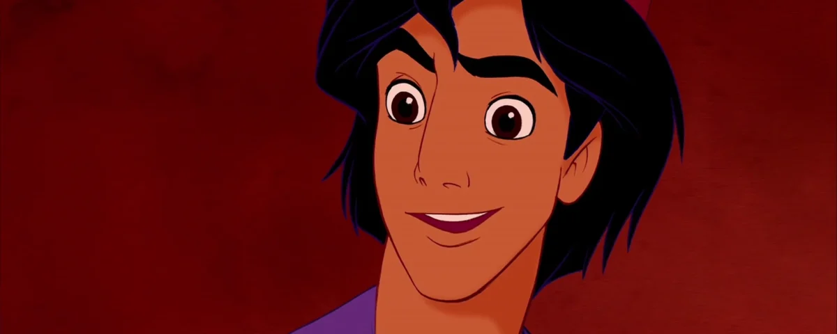 Image animée d'Aladdin, un personnage à la peau bronzée et aux cheveux noirs, portant un gilet violet, souriant sur un fond rouge difficile.