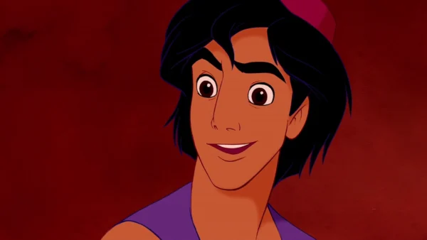 Image animée d'Aladdin, un personnage à la peau bronzée et aux cheveux noirs, portant un gilet violet, souriant sur un fond rouge difficile.