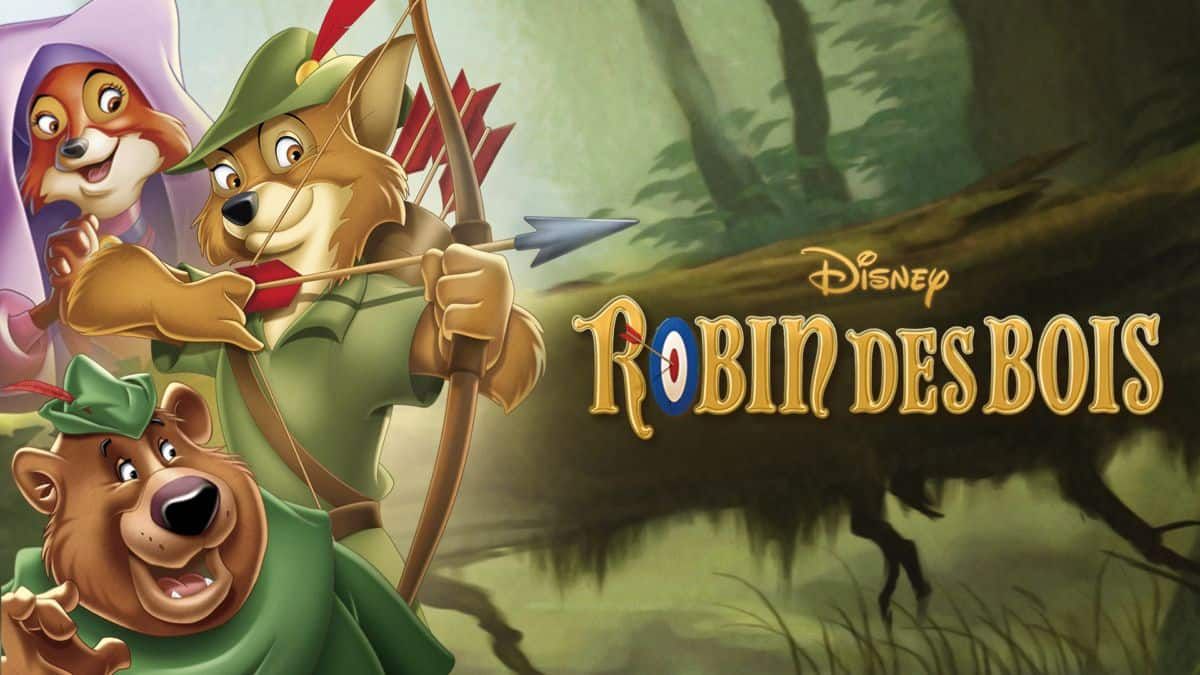 Image promotionnelle pour "Robin des Bois" de Disney, mettant en vedette des personnages animés : un renard habillé en Robin des Bois avec un arc et des flèches, et un ours en Petit Jean, contre une forêt