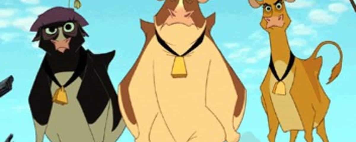 Trois vaches animées du film "La Ferme se Rebelle" debout dans un paysage désertique ; un noir, un marron et un beige, tous portant des cloches.