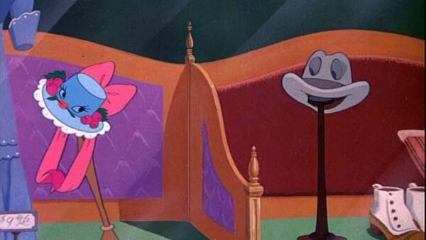 Une image de bande dessinée représentant une lampe anthropomorphe et un porte-chapeau se souriant, dans une pièce cosy au décor coloré et un soupçon de "la boîte à musique" en arrière-plan.