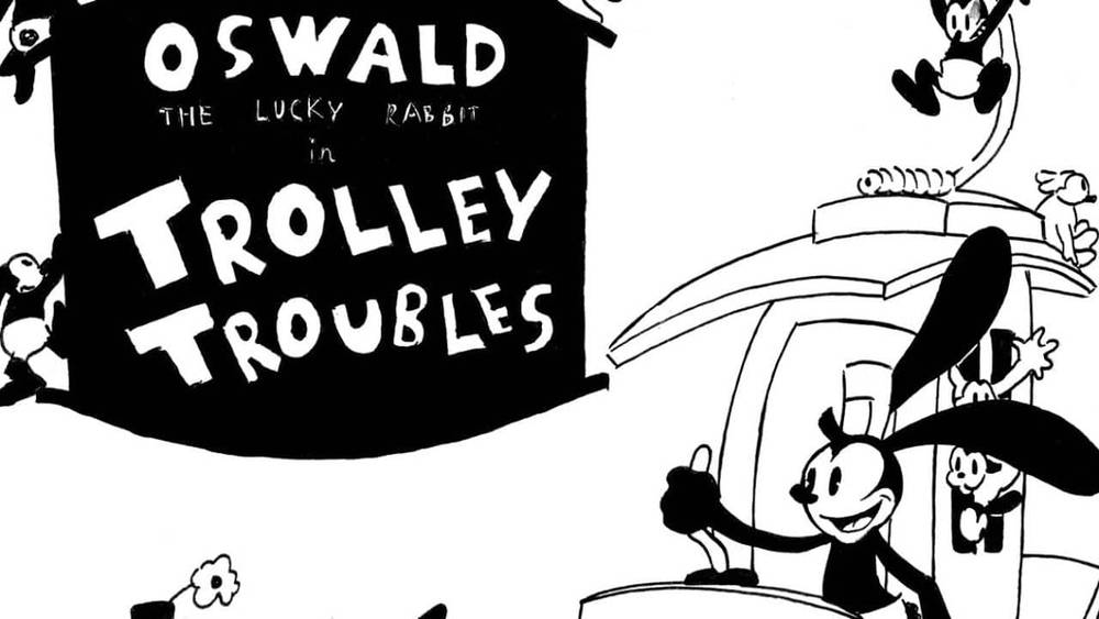 Illustration en noir et blanc représentant Oswald le lapin porte-bonheur, conduisant joyeusement un chariot, avec le titre "Oswald le lapin chanceux dans les problèmes de chariot" affiché ci-dessus.