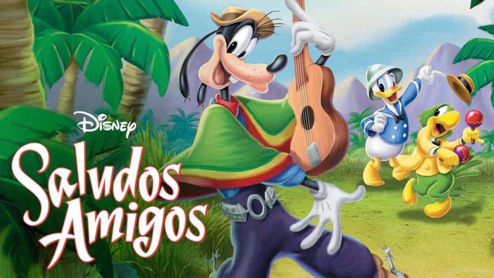 Image de "Saludos Amigos" de Disney mettant en vedette Dingo jouant de la guitare et Donald Duck avec José Carioca et un petit perroquet dansant joyeusement dans un décor de jungle.