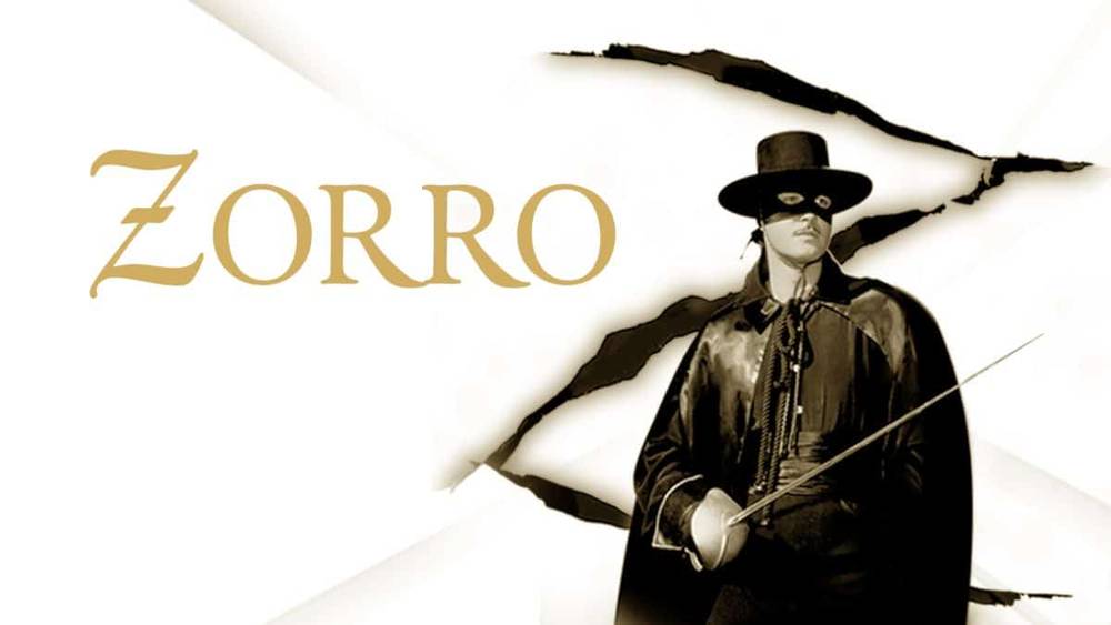 Image promotionnelle pour Zorro représentant un personnage vêtu d'un costume traditionnel noir avec un masque et un chapeau, tenant une épée, sur un fond avec un effet de papier déchiré et le nom "Zorro