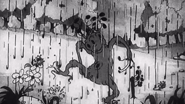 Une image animée en noir et blanc montrant des créatures fantaisistes dansant joyeusement sous la pluie printanière, l'une d'entre elles ressemblant à un singe tenant des fleurs. Les gouttes de pluie sont représentées par des lignes verticales remplissant la scène.
