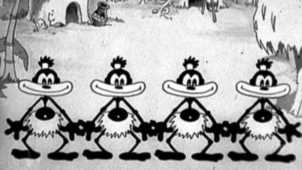 Image en noir et blanc de cinq personnages Disney animés et originaux avec de grands yeux et des corps moelleux, chacun arborant un large sourire à pleines dents et se tenant la main en ligne.