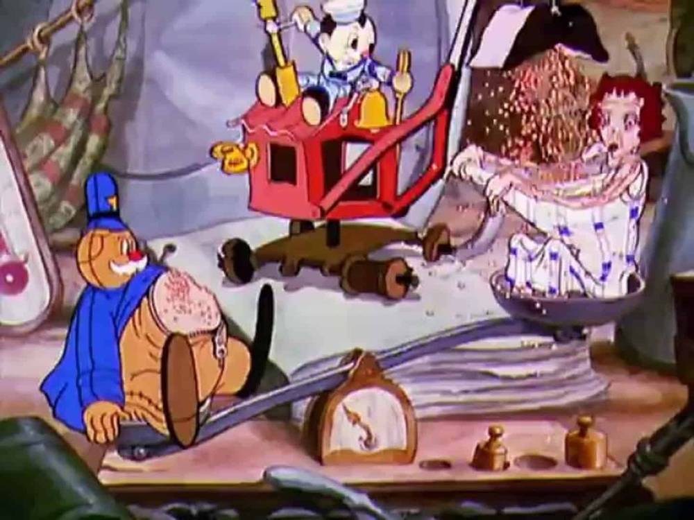 Scène animée montrant Popeye dans une tenue bleue actionnant une machine à pop-corn, tandis qu'Olive Oyl, surprise, se fait doucher par le pop-corn de la machine pendant Noël.