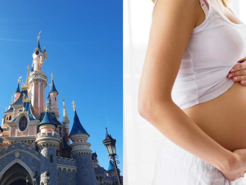 Une femme enceinte devant le château de Disneyland Paris.