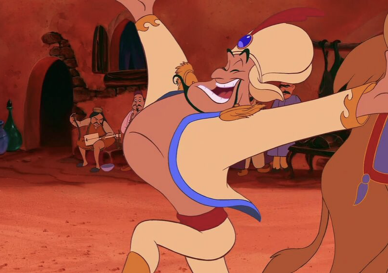 Une caricature d'un homme dansant avec un lion, qui rappelle les aventures magiques d'Aladdin dans le rôle du prince Ali.