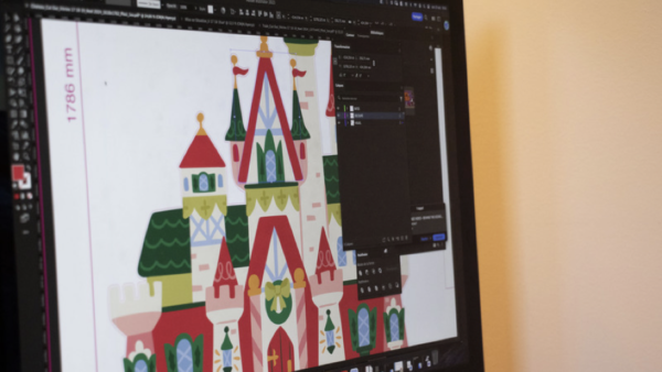 Sur l'écran de l'ordinateur, un design de château coloré rappelant Disneyland Paris se dresse majestueusement dans l'interface du logiciel d'édition graphique, une véritable merveille d'art numérique.