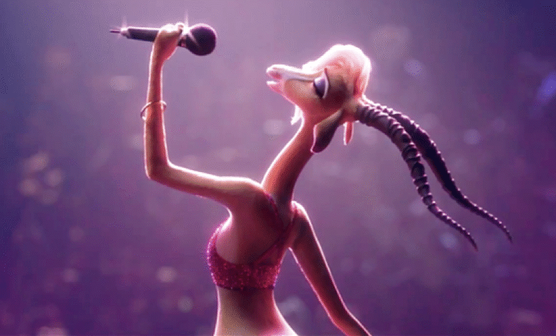 Un personnage de gazelle animé portant une tenue rouge scintillante tient un microphone et chante « Try Everything » sur scène sous des lumières vives.