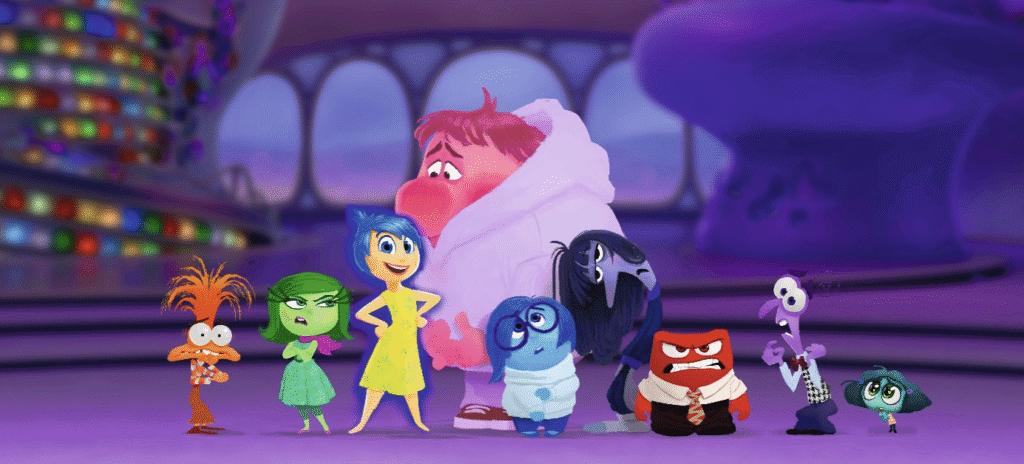 Un groupe de personnages animés d'Inside Out (Vice-Versa) se tient ensemble dans un décor coloré et futuriste.