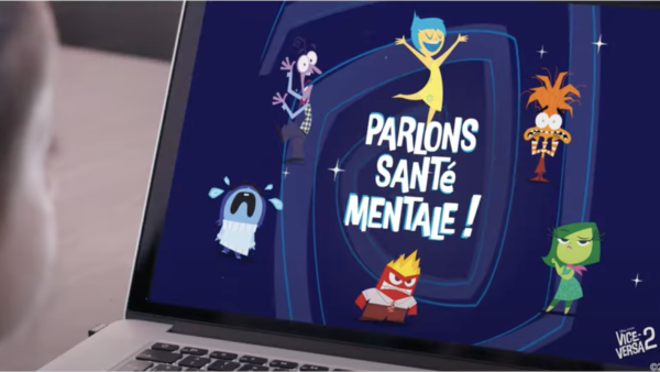 Un écran d'ordinateur portable affiche des personnages de dessins animés avec le texte français "Parlons santé mentale !" et la marque Disney/Pixar, vus par un enfant. La scène suggère que Disney France promeut Vice-versa pour susciter des conversations sur la santé mentale.