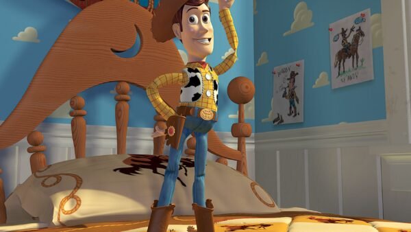Un cow-boy animé, qui rappelle l'impact de Toy Story sur l'industrie de l'animation, est posé sur le lit d'une chambre d'enfant au thème western, avec des dessins de chevaux et une tête de lit en bois en forme de cheval.