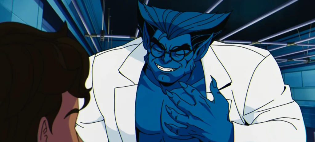 Un personnage musclé à la peau bleue, aux oreilles pointues et aux lunettes, vêtu d'une blouse de laboratoire blanche, fait des gestes tout en parlant à quelqu'un que l'on ne voit pas dans une pièce très éclairée - une scène emblématique de X-men '97 qui est actuellement diffusée en streaming sur Disney+.