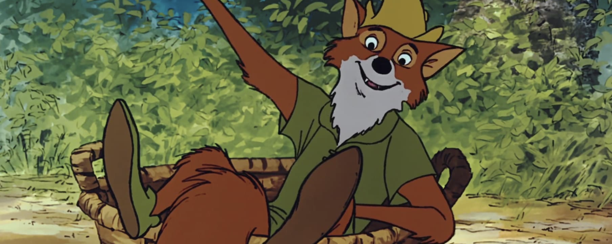 Le renard animé en chemise et chapeau verts, inspiré par Robin des Bois, est assis dans un panier tressé, un bras levé, entouré d'un feuillage luxuriant - une scène qui rappelle la première du film le 8 novembre 1973.