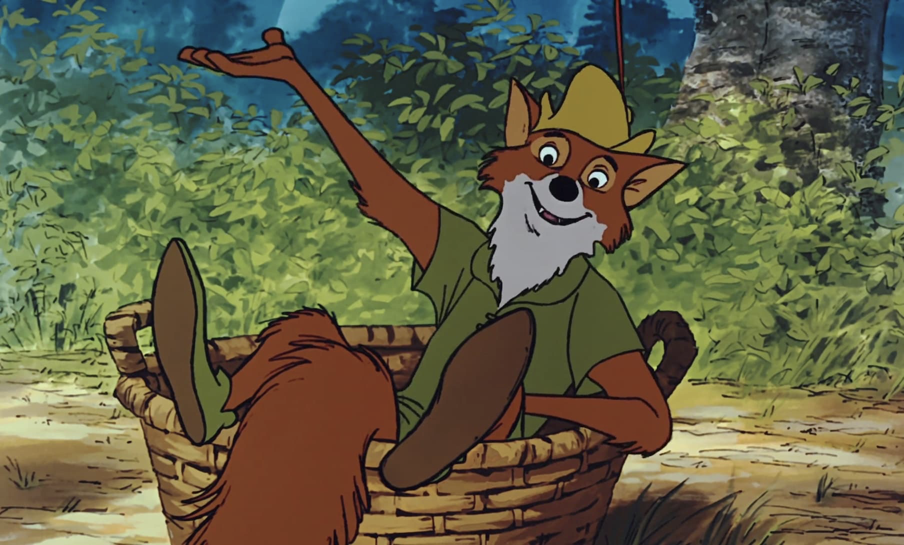 Le renard animé en chemise et chapeau verts, inspiré par Robin des Bois, est assis dans un panier tressé, un bras levé, entouré d'un feuillage luxuriant - une scène qui rappelle la première du film le 8 novembre 1973.