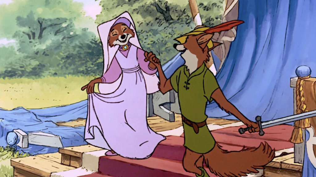 Sur une scène extérieure aux rideaux bleus, Robin des Bois, un renard animé en vert, tient une épée et la patte d'une femelle renard en rose - reprenant la magie de la première du 8 novembre 1973.