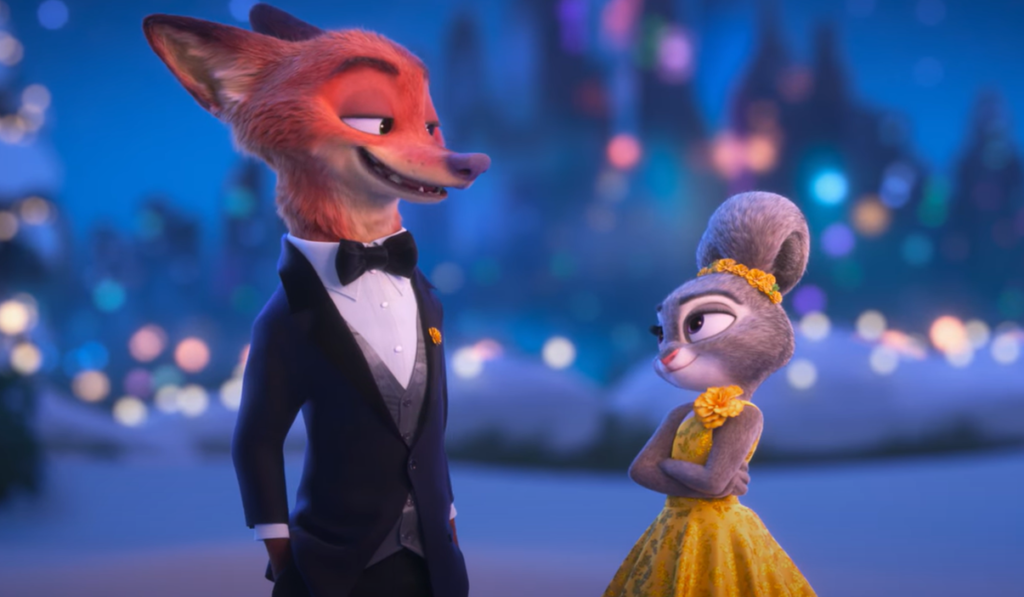 Un renard en smoking noir et un lapin en robe jaune se tiennent côte à côte, l'un face à l'autre, avec un paysage urbain flou en arrière-plan. Cette image illustre le charme de Zootopie 2 de Disney et l'engouement qu'il devrait susciter au box-office.